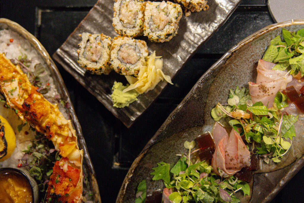 King Crab Legs, King Crab Roll, and Kanpachi Carpaccio from the Sushi and Robata by Ulu menu at Four Seasons Hualalai. 